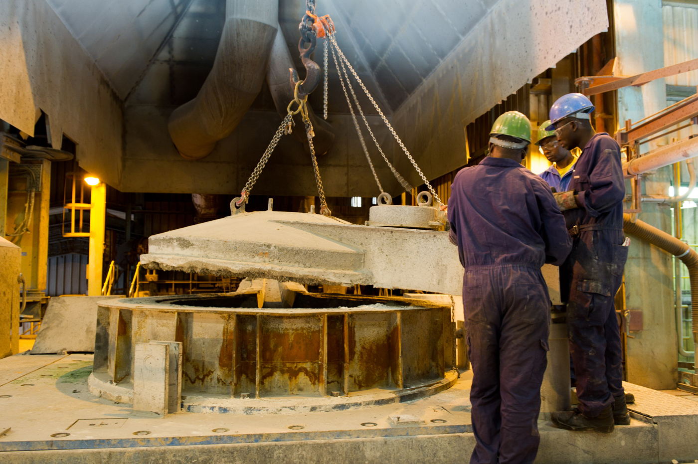 Workers in Lubumbashi, Democratic Republic of the Congo, tend to an oven that processes slag from the region's cobalt and copper-rich ores.