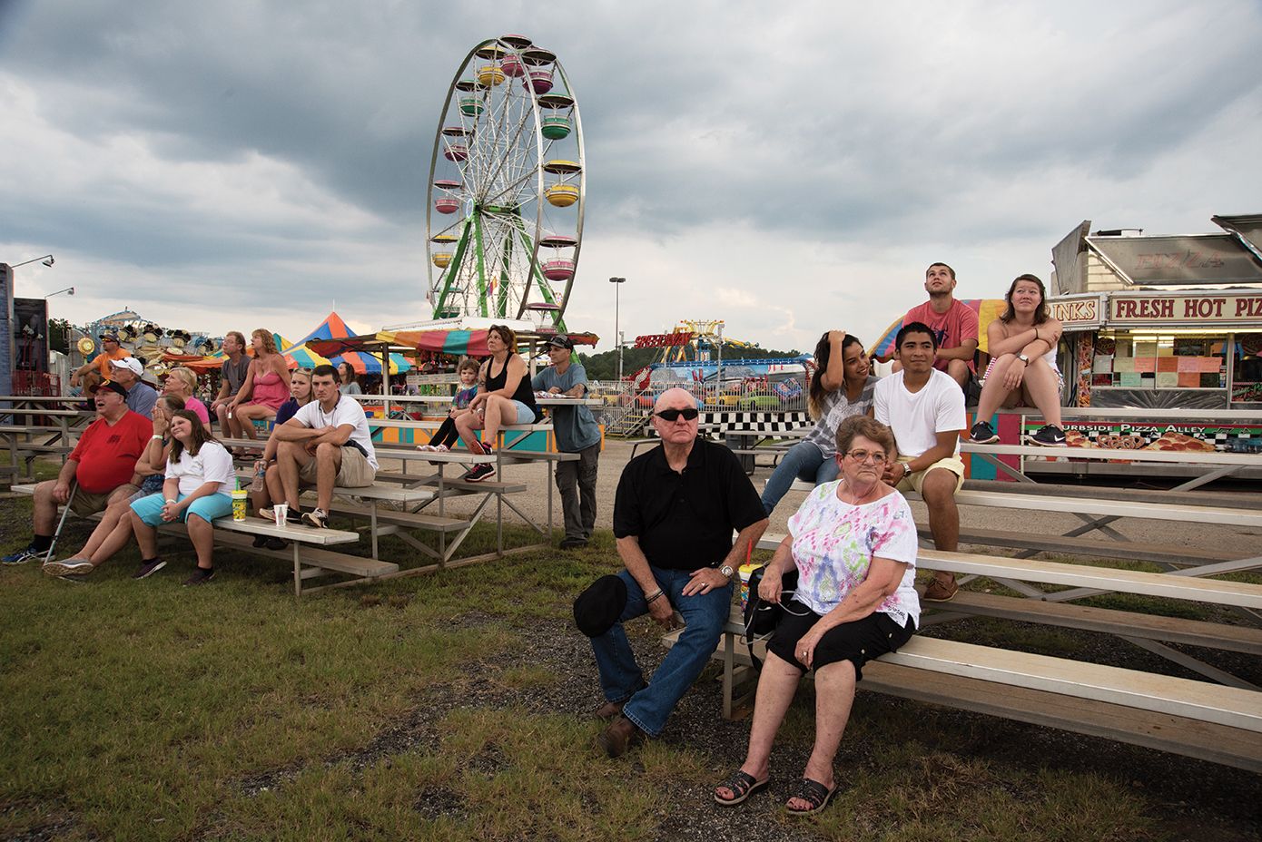 A family enjoys the Upper South Carolina State Fair at the NASCAR Greenville Pickens Speedway.