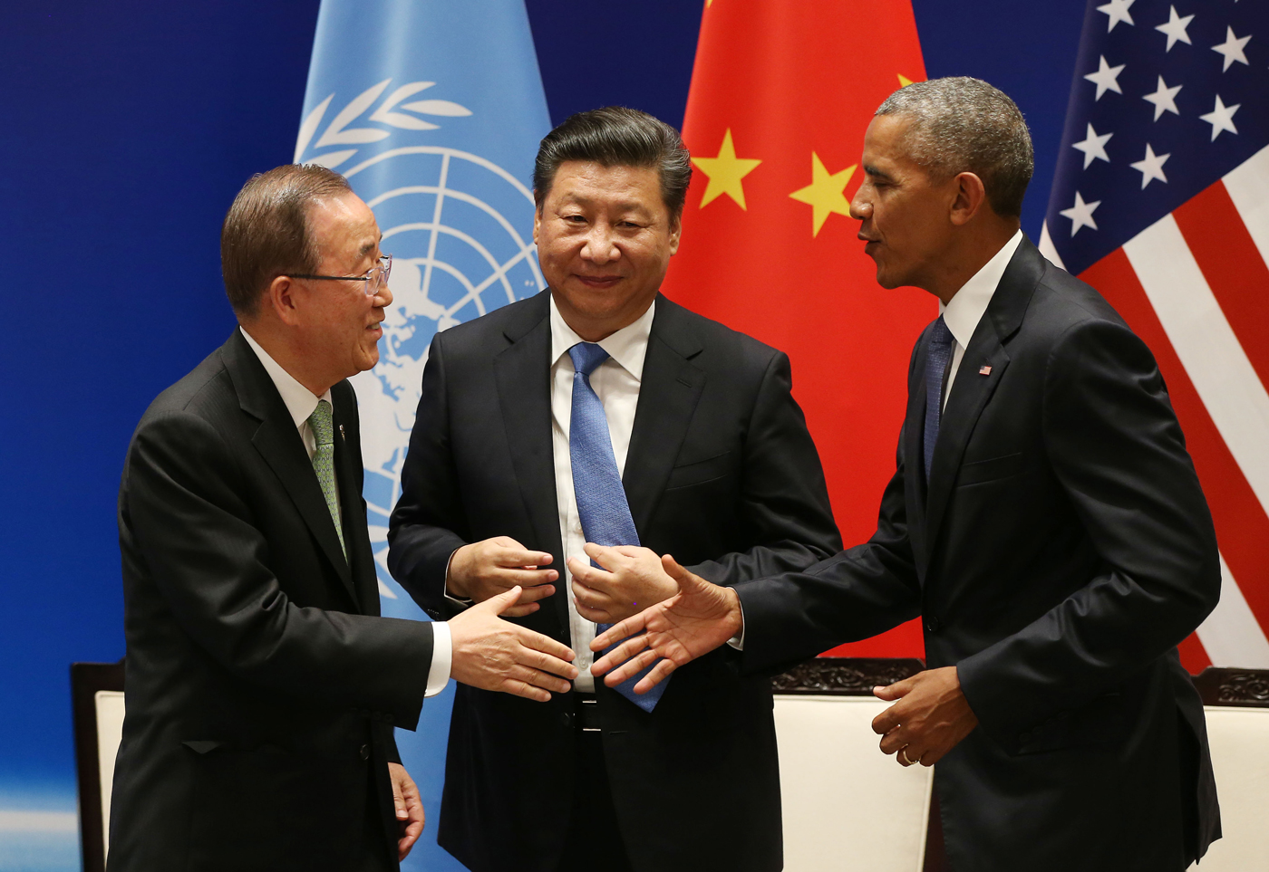 U.N. Secretary General Ban Ki-moon, Chinese President Xi Jinping, and U.S. President Barack Obama shake hands after China and the U.S. signed on to the Paris climate agreement in September 2016.