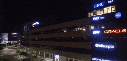 These flickering lights are being controlled by a drone flying alongside the building.
