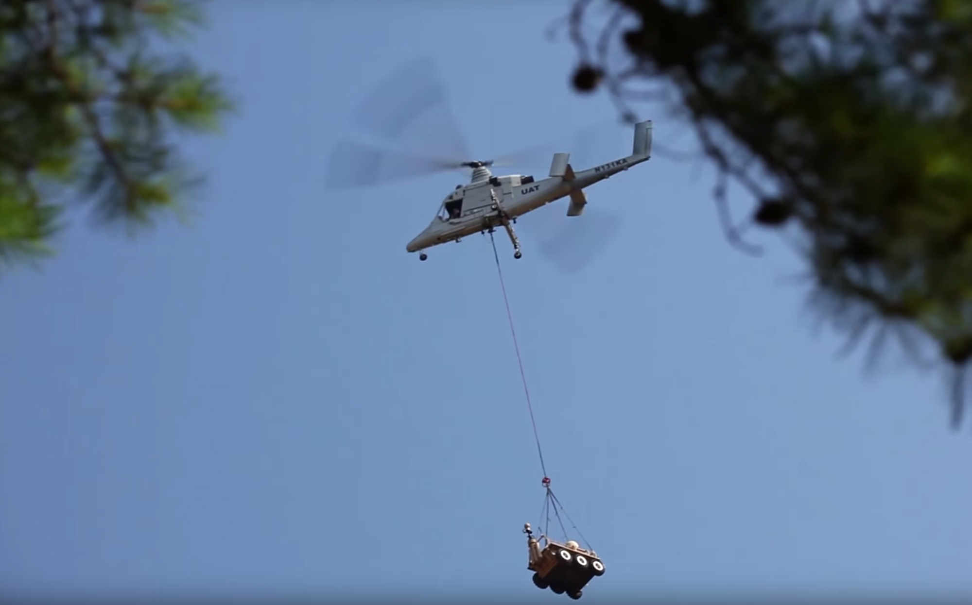 Lockheed Martin's autonomous K-MAX helicopter hauling a piece of gear.