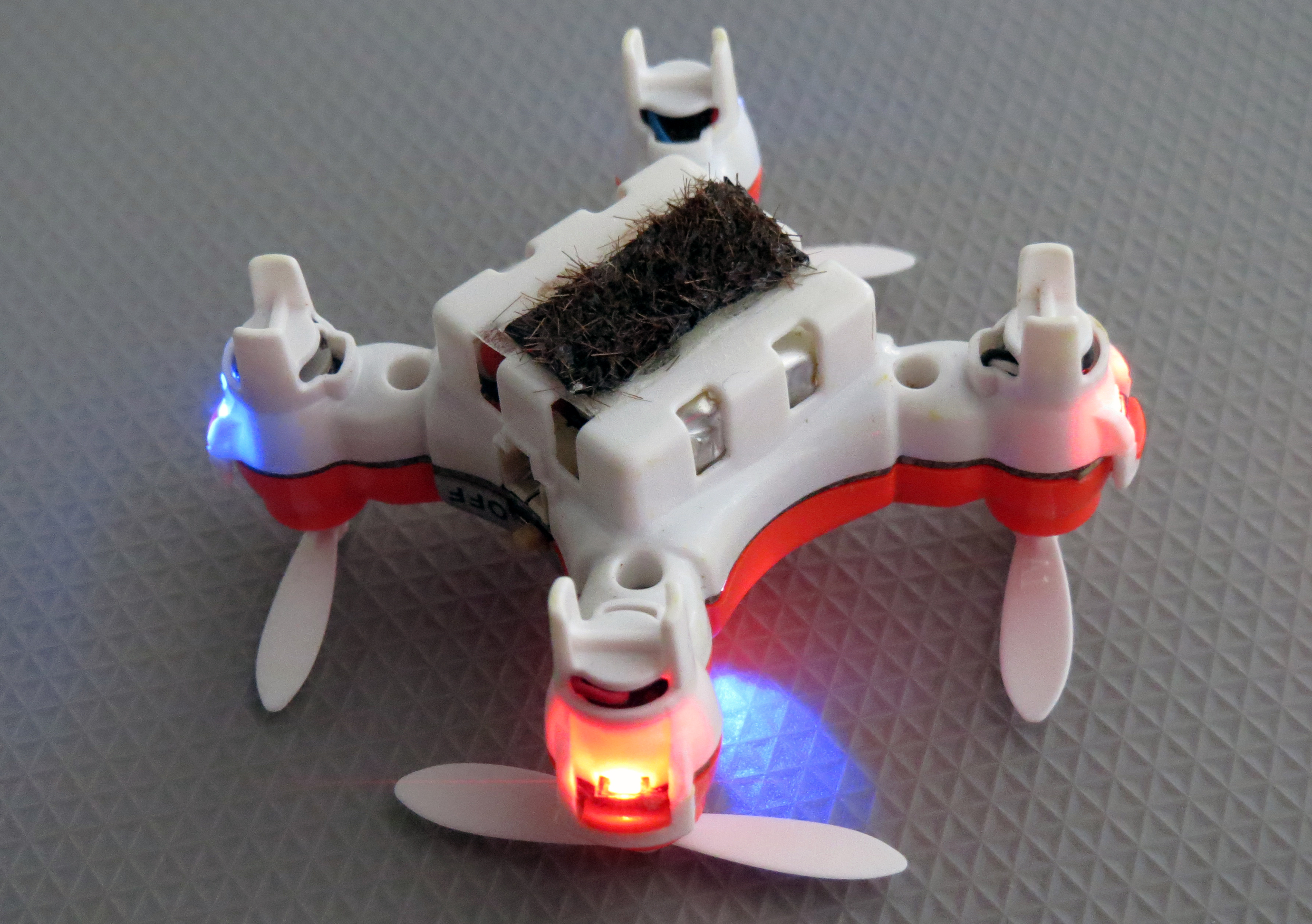 To create their artificial bee, Japanese scientists glued horsehair to the bottom of a $100 drone purchased from Amazon.com.