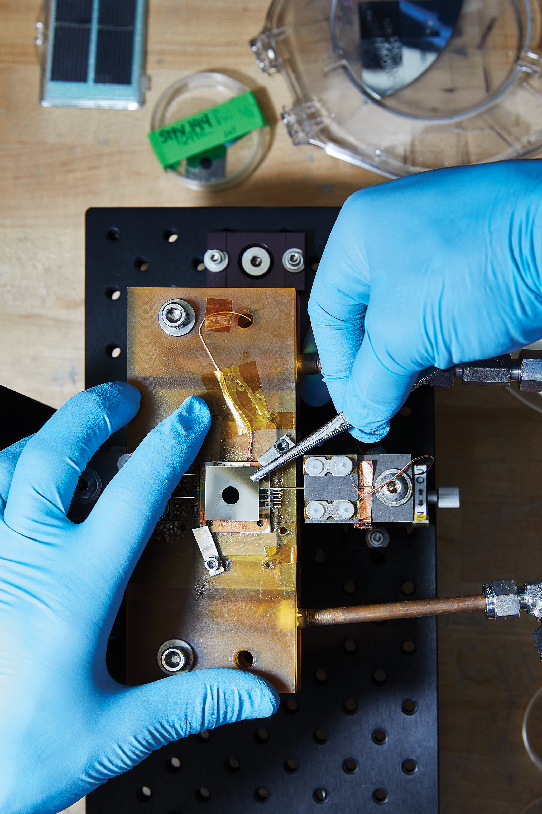 The absorber-emitter layer is situated above an optical filter and photovoltaic cell, which is visible underneath.