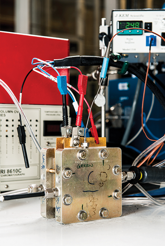 The reactor has inputs for carbon dioxide and outputs for the chemicals.