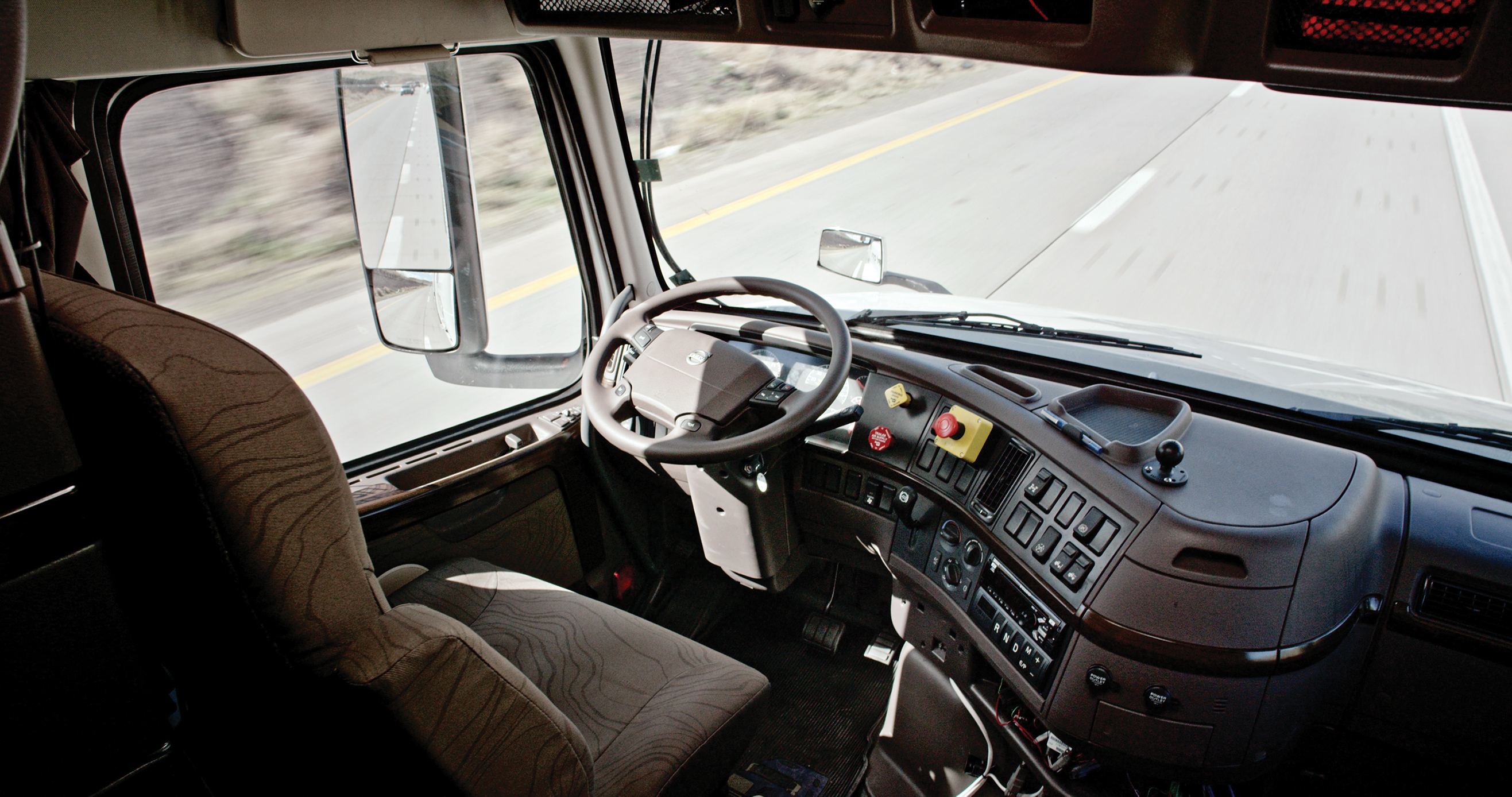 A human can push the red buttons to the right of the steering wheel to instantly take over from the self-driving system.