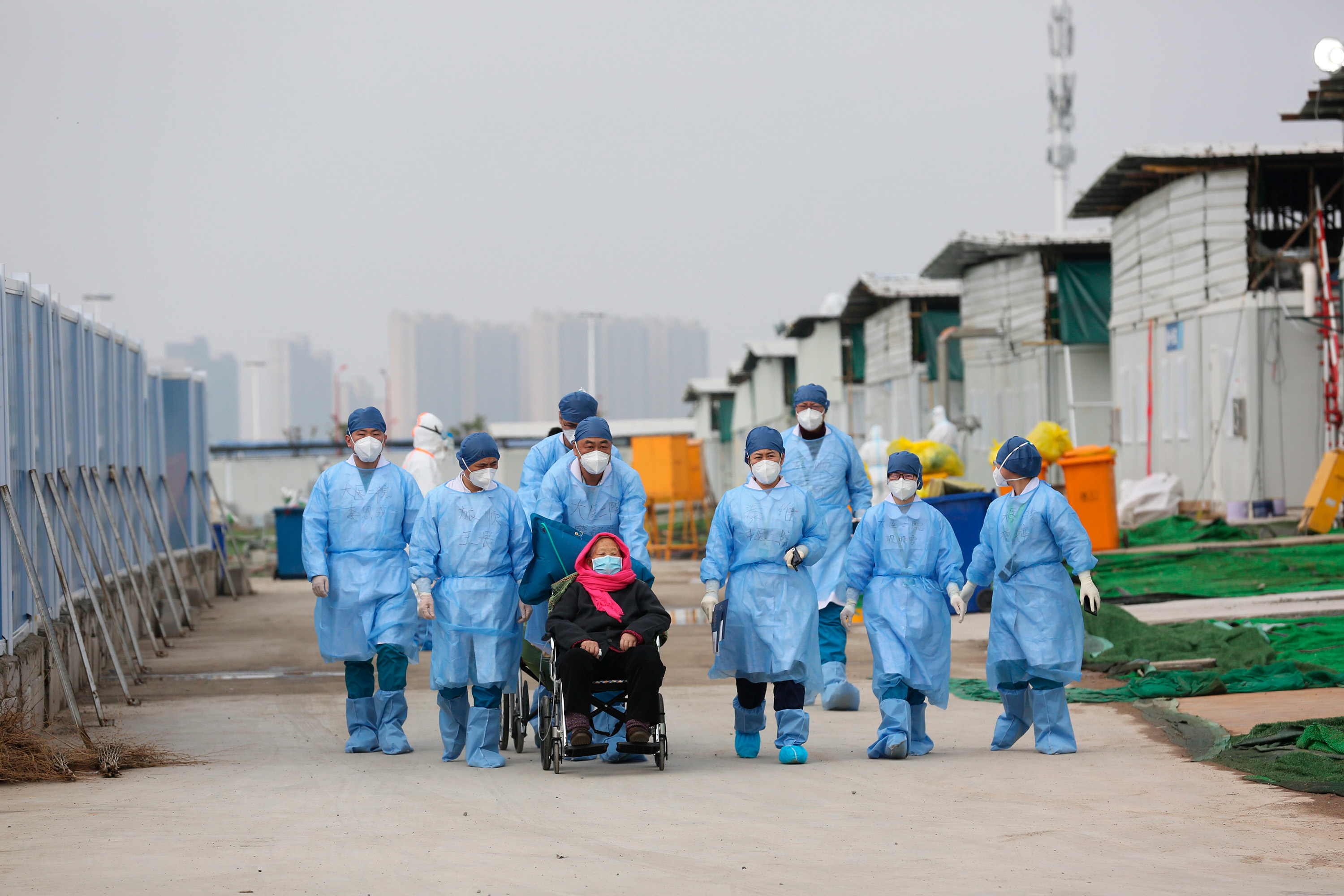 Patient being discharged from Leishenshan Hospital to observational facility.