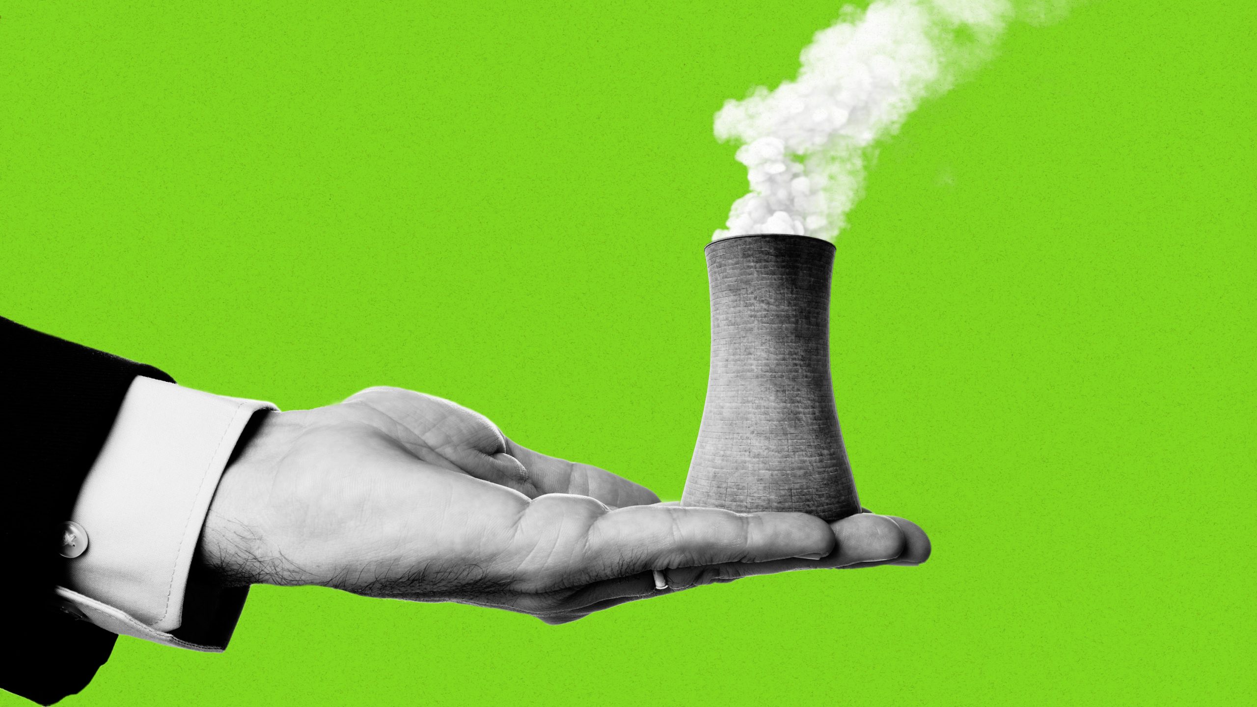 hand holding a cylindrical nuclear cooling tower with steam escaping out the top