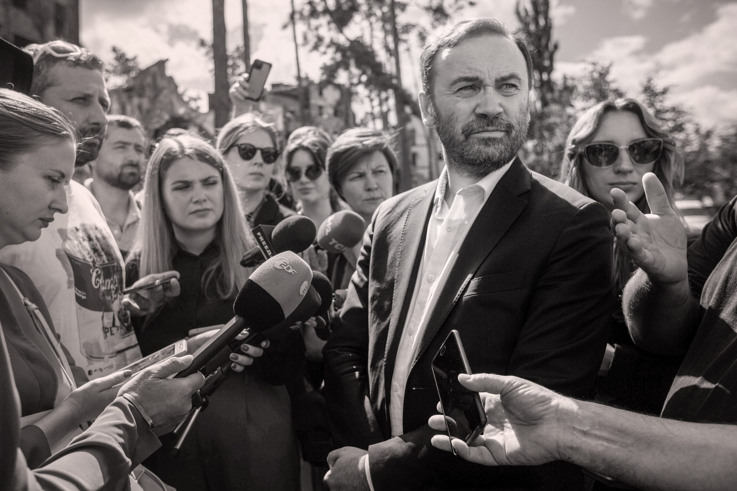Ilya Ponomarev surrounded by the media